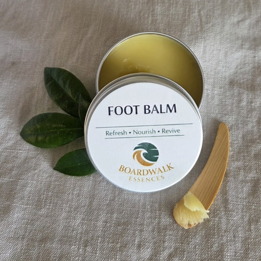Foot Balm 50g aluminium tin with cream label and gold border arranged with gentle botanical elements